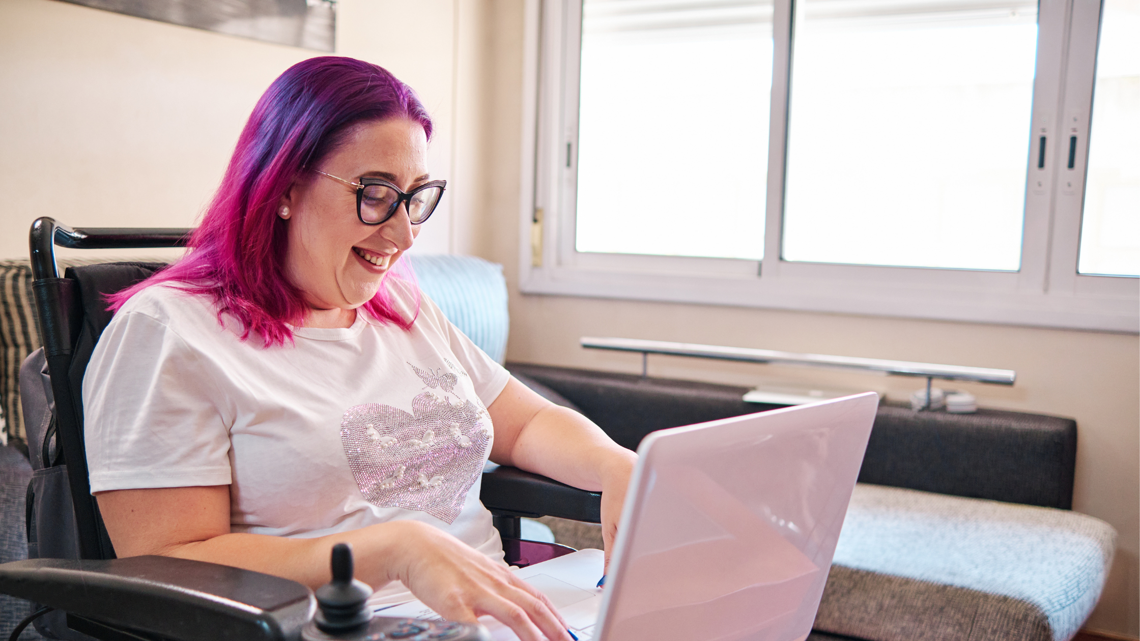 Person with wheelchair using a computer